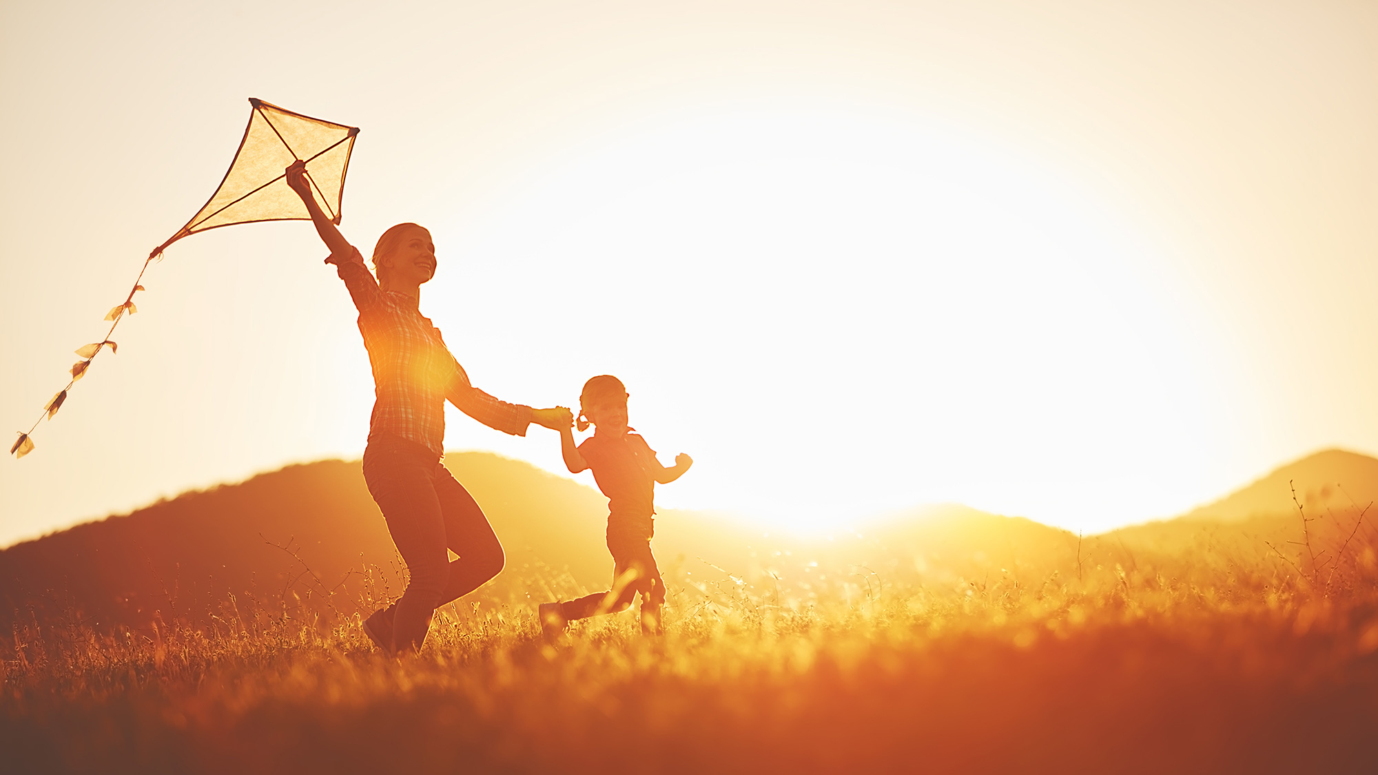 Woman and child with a kite