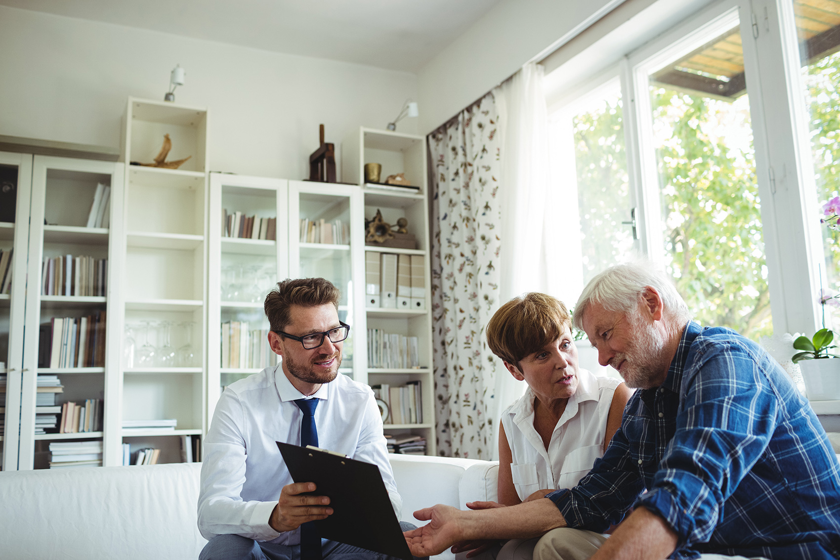 Adviser presenting info to a couple